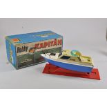 An unusual large scale plastic battery operated Hobby Kapitan Police Boat. Generally Fair Plus to