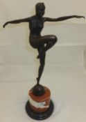 A bronze effect figure of a lady dancing