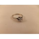 A solitaire diamond ring in white metal mount CONDITION REPORTS Overall with wear, scuffs and