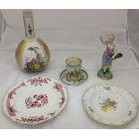 A collection of Continental porcelain and pottery wares to include a Meissen style plate retailed by