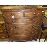 An early 19th Century mahogany bow fronted chest of two short and four long graduated drawers on