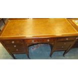 An Edwardian mahogany desk, the tooled a