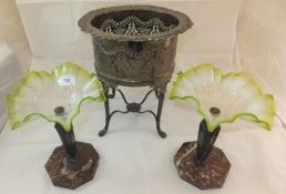 An electro-plated plant stand on four le