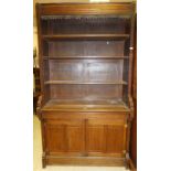 A Victorian oak bookcase cabinet with op