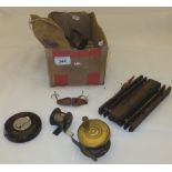 A box of fishing ephemera to include a wooden line winder, lure, small brass fishing reel with