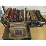 Four boxes containing various books on t