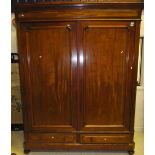 A Victorian mahogany two door wardrobe with two drawers under, on bun feet CONDITION REPORTS