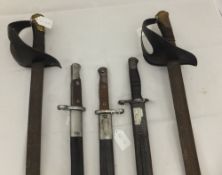 A sword by A & E Horster, one other sword, two carbine bayonets and a Remington 1907 pattern