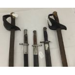 A sword by A & E Horster, one other sword, two carbine bayonets and a Remington 1907 pattern