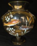 A smoked amber coloured glass ground vase decorated with two raised fish among foliage CONDITION