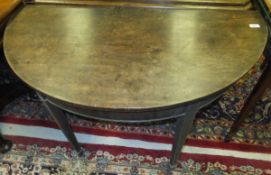 A 19th Century mahogany demi-lune dining