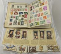 A World postage stamp album and contents of British and World stamps including Penny Black, Twopenny