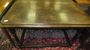 An oak centre table on turned legs to bl