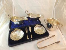 A pair of George V silver sauceboats wit