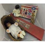 A boxed Herald Series of model soldiers, a canework dolls' crib, three various dolls and a boxed