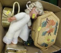 A modern doll and box of various sewing