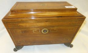 A rosewood and brass inlaid sarcophagus