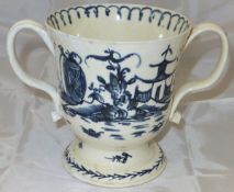 An 18th Century English Delft ware twin-handled loving cup painted in blue in the chinoiserie