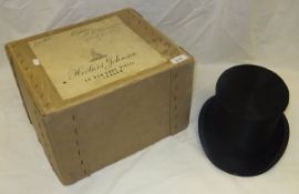 A Herbert Johnson black silk top hat, housed in a cardboard box CONDITION REPORTS Cardboard box with
