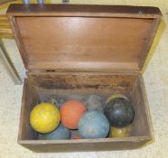 A box of assorted croquet balls