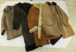 A collection of four sheepskin coats
