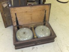 A cased set of curling stones, each ston