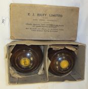 A pair of E. J. Riley Lignum Vitae bowls
