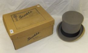 A grey top hat by Scott & Co, housed in