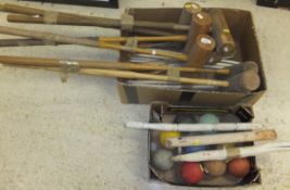 A collection of croquet mallets, balls a