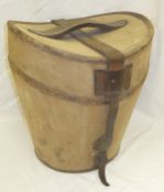 A canvas covered hat box, bears label in