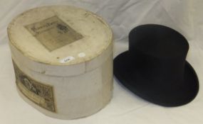 A black silk top hat, housed in a Perkin Brothers Plymouth hat box CONDITION REPORTS Cardboard box