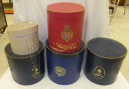 A collection of six hat boxes for top an