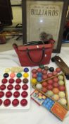 Three early 20th Century ivory billiard balls, a harlequin set of snooker balls, a triangle and "