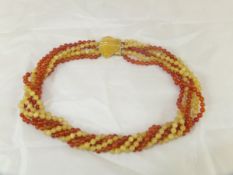 A hard stone multi-strand necklace with