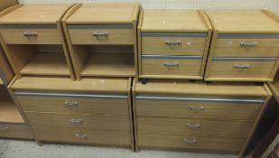 A pair of beech effect two drawer chests