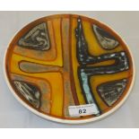 A Poole pottery shallow dish decorated i