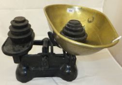 An iron set of weighing scales with bras