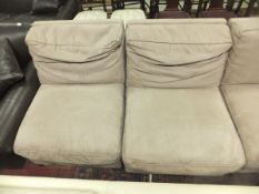 Three single brown suede chairs raised o