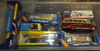 A box containing six Corgi model lorries