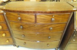 A Victorian mahogany bow fronted chest of two short and three long graduated drawers CONDITION