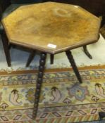 An octagonal walnut gypsy table, raised
