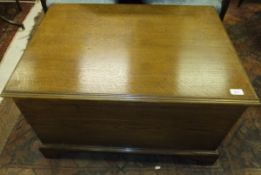 An oak chest with rising lid and brass h