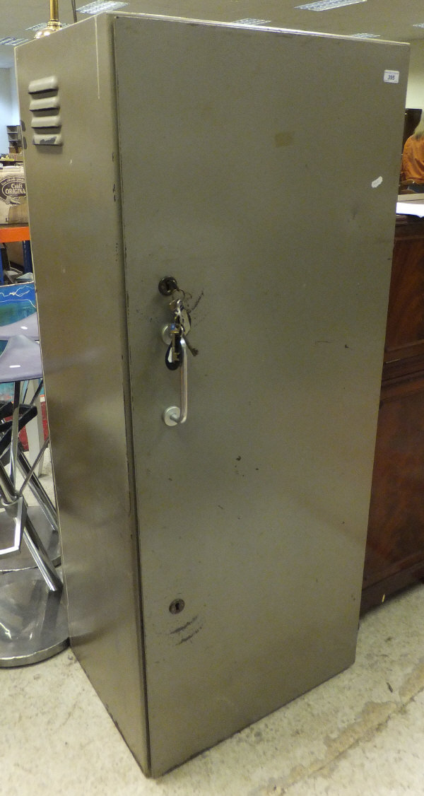 A mid 20th Century painted steel 16 gun cabinet with twin lock mechanism and alarm with bell (NON