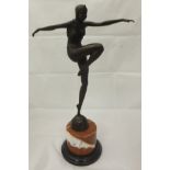 A bronze effect figure of a lady dancing