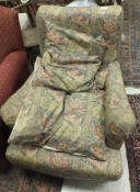 A Victorian armchair in floral patterned
