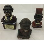 Three cast iron blackamoor money boxes,