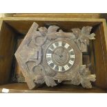 A Black Forest type cuckoo clock (for restoration), a Tameside mantel clock in oak lancet form case,