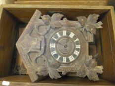 A Black Forest type cuckoo clock (for restoration), a Tameside mantel clock in oak lancet form case,