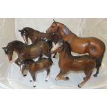 A collection of five Beswick horses to include four gloss examples and one matt example entitled "