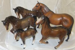 A collection of five Beswick horses to include four gloss examples and one matt example entitled "